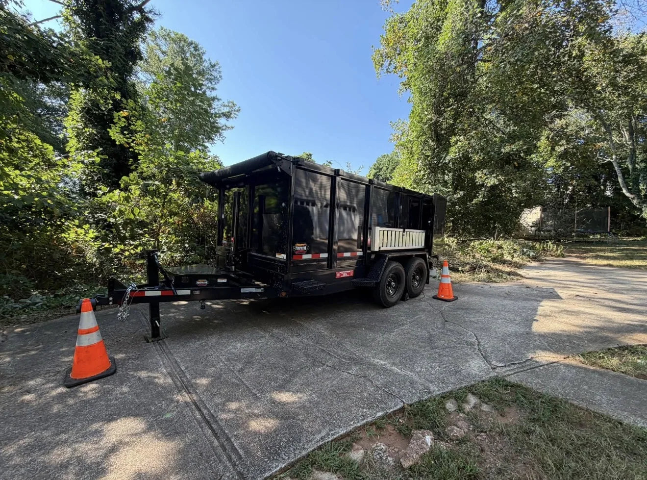 TopCut black dump trailer available for rent